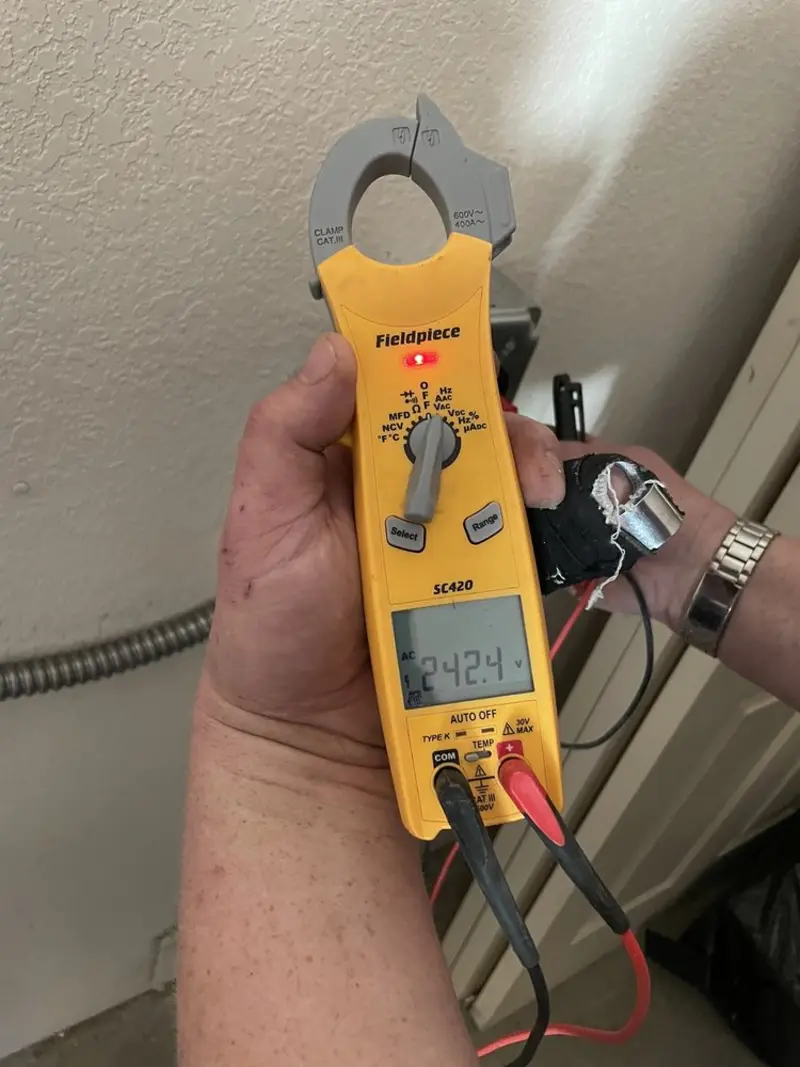 Voltage testing with clamp meter during Electrical Installation Services in Audubon